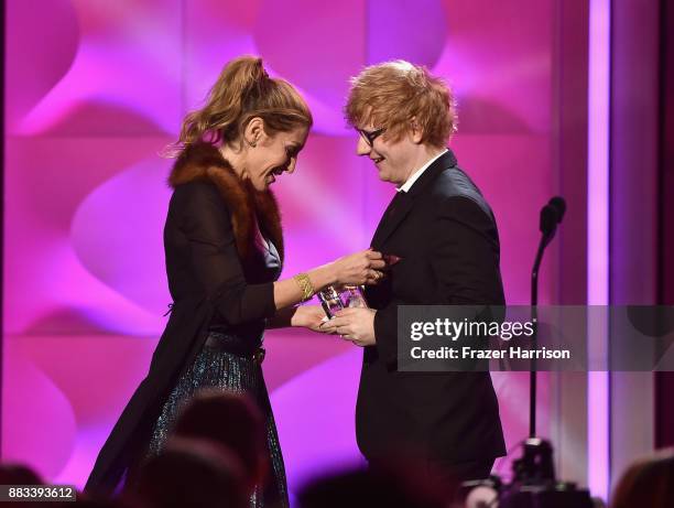 Honoree Julie Greenwald accepts the Executive of the Year Award from Ed Sheeran onstage during Billboard Women In Music 2017 at The Ray Dolby...