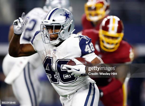 Alfred Morris of the Dallas Cowboys carries the ball in the second half of a football game against the Washington Redskins at AT&T Stadium on...