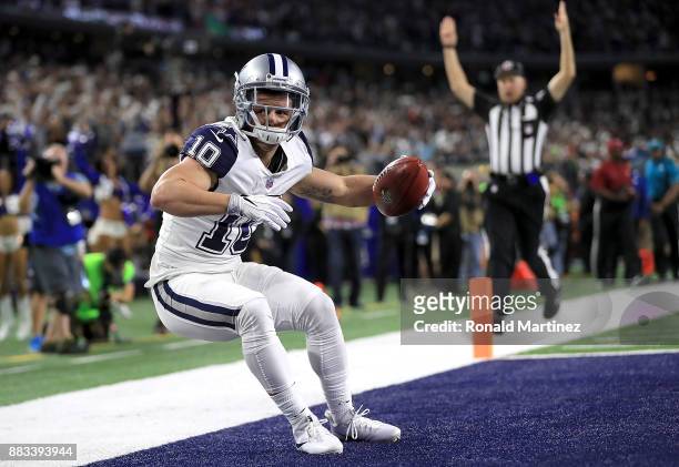 Ryan Switzer of the Dallas Cowboys dives into the endzone on an 83-yard touchdown punt return against the Washington Redskins in the second quarter...