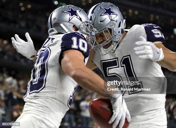 Ryan Switzer an 83-yard touchdown punt return with Kyle Wilber against the Washington Redskins in the second quarter at AT&T Stadium on November 30,...