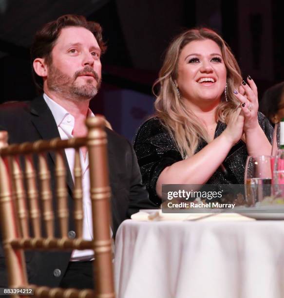 Brandon Blackstock and honoree Kelly Clarkson attend Billboards Women in Music 2017 presented in partnership with FIJI Water on November 30, 2017 in...