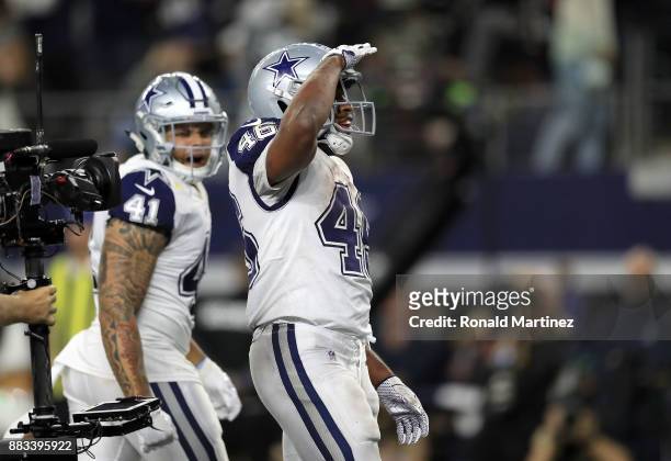 Alfred Morris of the Dallas Cowboys celebrates a fourth quarter rushing touchdown against the Washington Redskins at AT&T Stadium on November 30,...