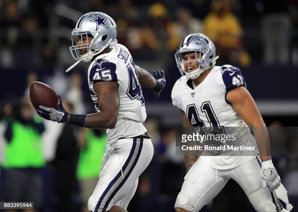 Rod Smith of the Dallas Cowboys and Keith Smith of the Dallas Cowboys celebrate a fourth quarter touchdown against the Washington Redskins at AT&T...