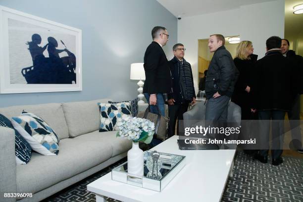 Board members and guests inspect The Bea Arthur Residence Building during its dedication on November 30, 2017 in New York City.