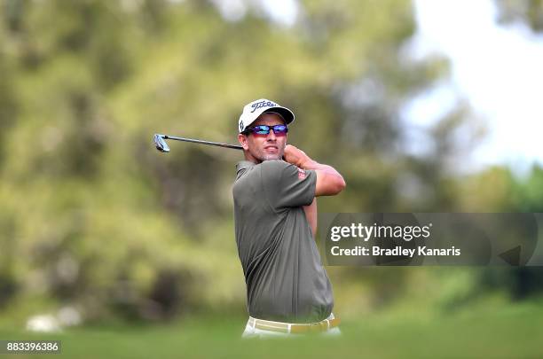 Adam Scott of Australia plays a shot on the 8th hole during day two of the Australian PGA Championship at Royal Pines Resort on December 1, 2017 in...