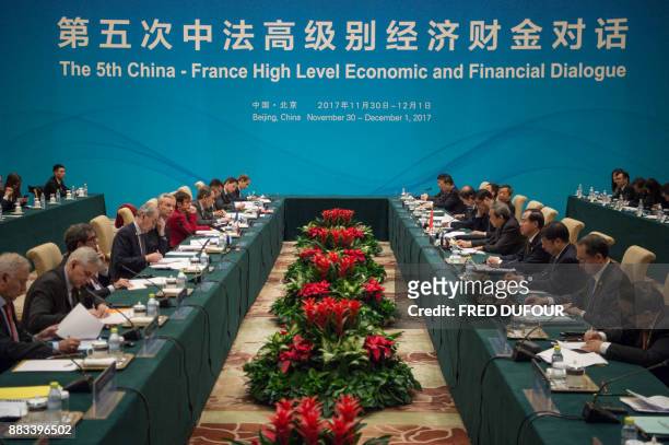 French Economic Minister Bruno Le Maire and Chinese Vice Premier Ma Kai attend a meeting at the High Level Economic and Financial Dialogue at the...