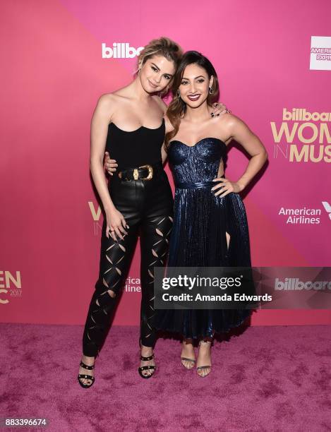 Singer Selena Gomez and actress Francia Raisa arrive at Billboard Women In Music 2017 at The Ray Dolby Ballroom at Hollywood & Highland Center on...