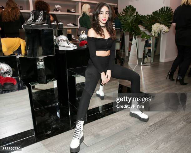 Model Sayda Hartoonian wears boots from Chloe Bartoli's RD x California Girls Spring '18 Rocket Dog Collection on November 30, 2017 in New York City.