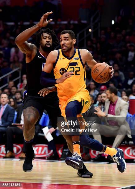Thabo Sefolosha of the Utah Jazz drives past DeAndre Jordan of the LA Clippers during a 126-107 win over the LA Clippers at Staples Center on...