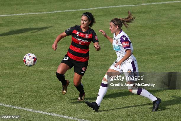 Lee Falkon of the Wanderers is challenged by Natasha Rigby of the Glory during the round six W-League match between the Western Sydney Wanderers and...