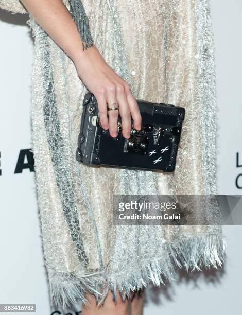Riley Keough, purse detail, attends an evening honoring Louis Vuitton and Nicolas Ghesquiere at Alice Tully Hall at Lincoln Center on November 30,...