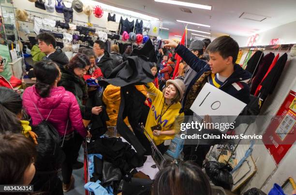 Vendors sell merchandise at the Dongding wholesale market before its closing on November 30, 2017 in Beijing, China. The Dongding market, the last of...