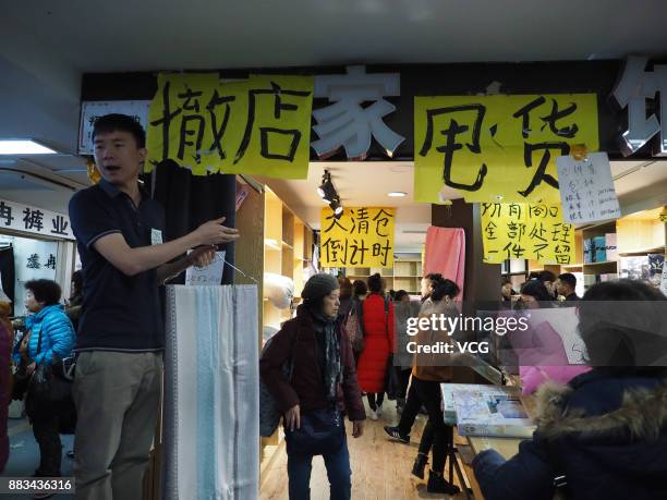 Vendor sells merchandise at the Dongding wholesale market before its closing on November 30, 2017 in Beijing, China. The Dongding market, the last of...