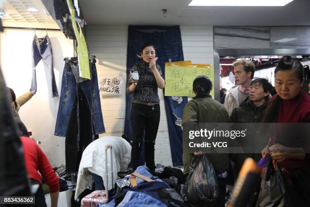 Vendor sells merchandise at the Dongding wholesale market before its closing on November 30, 2017 in Beijing, China. The Dongding market, the last of...