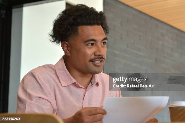 happy maori student man smile in university library - auckland university stock pictures, royalty-free photos & images