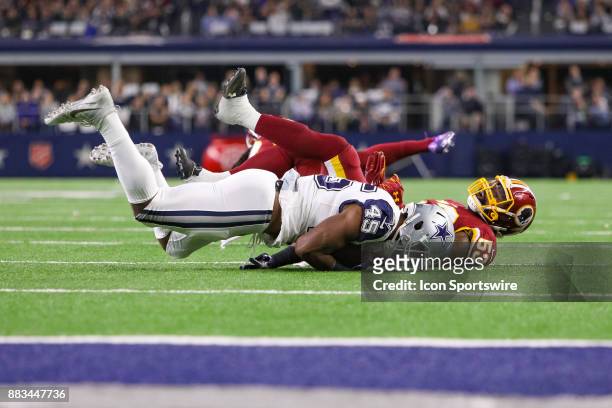 Dallas Cowboys fullback Rod Smith is tackled by Washington Redskins linebacker Zach Brown during the Thursday Night Football game between the...
