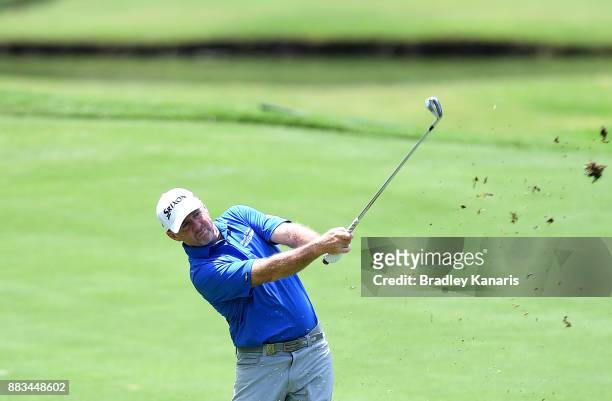 Rod Pampling of Australia plays a shot on the 8th hole during day two of the Australian PGA Championship at Royal Pines Resort on December 1, 2017 in...