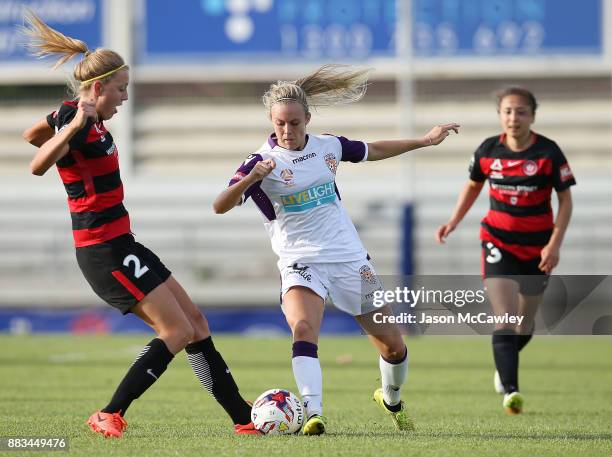 Rachel Hill of the Glory is challenged by Maruschka Waldus of the Wanderers during the round six W-League match between the Western Sydney Wanderers...