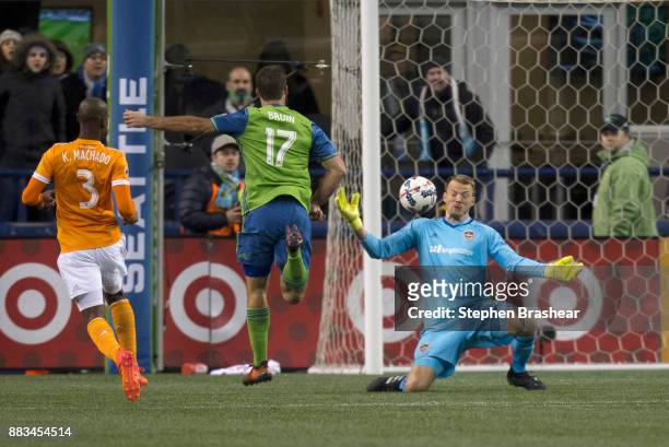 Goalkeeper Joe Willis of the Houston Dynamo is unable to make a save on a shot by Will Bruin of the Seattle Sounders as Adolfo Machado of the Houston...