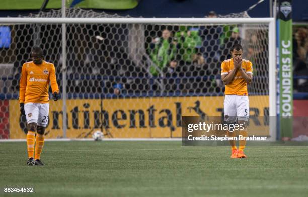 Boniek Garcia of the Houston Dynamo and Juan Cabezas of the Houston Dynamo react after a goal by Will Bruin of the Seattle Sounders during the second...