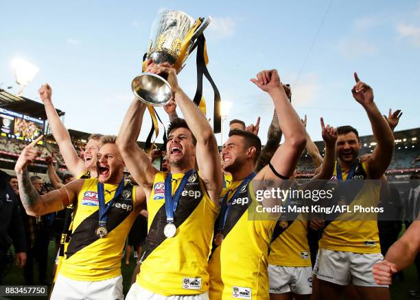 Trent Cotchin captain of the Tigers celebrates victory with team mates as they leave the pitch during the 2017 AFL Grand Final match between the...