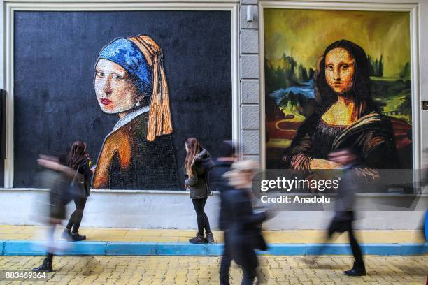 Leonardo da Vinci's ''Mona Lisa'' and Johannes Vermeer's ''Girl With A Pearl Earring''made from plastic cover by municipal personnel as part of the...