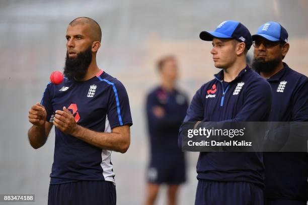 Moeen Ali of England chats with Saqlain Mushtaq spin-bowling Coach of England and Mason Crane of England during an England nets session at Adelaide...