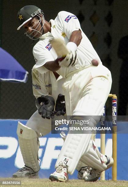 Pakistan captain Waqar Younis hits out on the third day of the first Test against Australia in Colombo 5 October 2002. Pakistan finished their first...