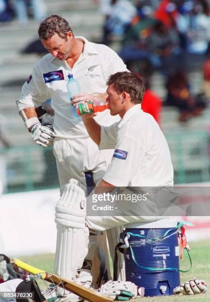 New Zealnd batsmen Mark Richardson and Lou Vincent take a break after their 100 partnership on the 4th day of the 2nd Test at Queen's Park National...