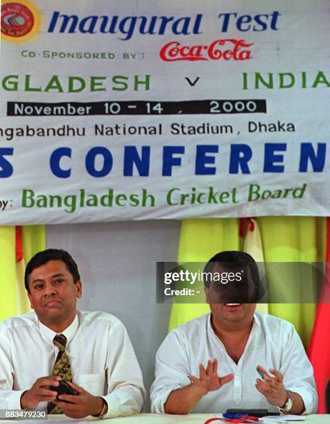 Bangladesh Cricket Board president Saber Hossain Chowdhury answers a question as BCB's general secretary Asraful Haque listens, during a press...