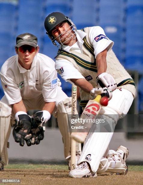 Pakistan batsman Younis Khan lofts the ball away for a six from New Zealand bowler Paul Wiseman on the first day of the first Test match being played...