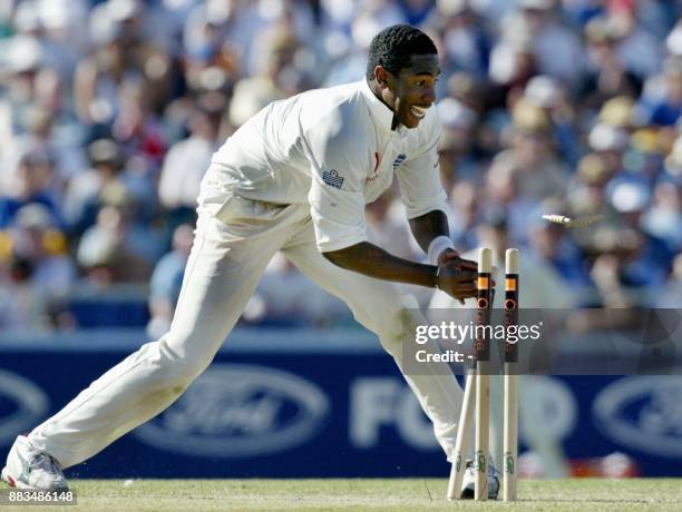 Alex Tudor of England breaks the stumps to run out Shane Warne from Australia for 35 runs during the third Ashes Test at the WACA ground in Perth, 30...