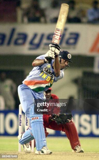 Indian batsman Yuvraj Singh hits a ball for boundary during the fourth one-day match against Zimbabwe at Lal Bahadur stadium in Hyderabad 16 March...