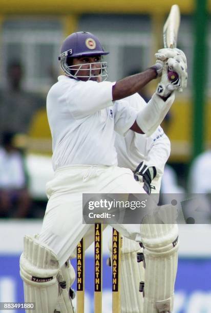 Sri Lankan batsman Mahela Jayawardena hits a ball for Four during the first day of the third and Final cricket test match between Sri Lanka and...