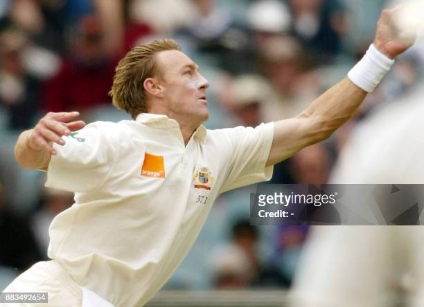 Australian fast bowler Andy Bichel catches South African batsman Lance Klusener off his own bowling for a golden duck on the second day of the second...