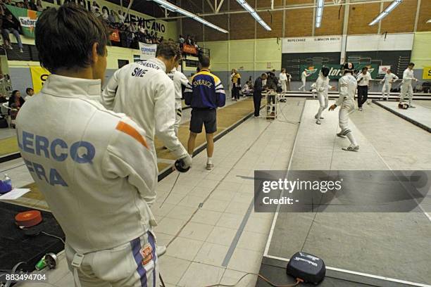 Frederic Clerq of France observes pre-Olympic test fencing during the Modern Pentathlon Mexican Cup 12 March 2000 in Mexico City. The elimination...
