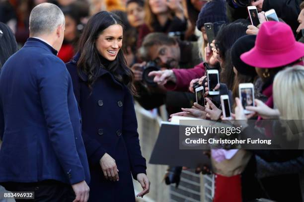 Meghan Markle is greeted by crowd as she arrives to Nottingham Contemporary on December 1, 2017 in Nottingham, England. Prince Harry and Meghan...