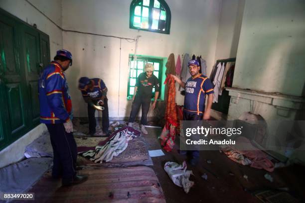 Pakistani security forces and rescuers at Peshawar Agricultural Training Institute which was attacked by Taliban militants, in the northwestern city...