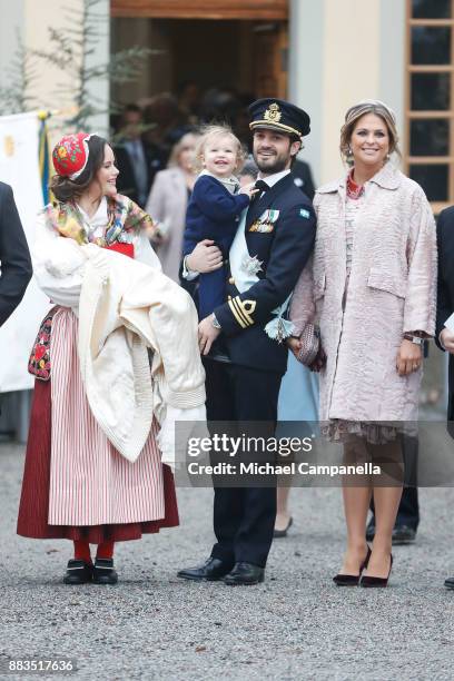 Prince Gabriel of Sweden, Duke of Dalarna held by Princess Sofia of Sweden and Prince Carl Philip holding Prince Alexander, Duke of Sodermanland and...