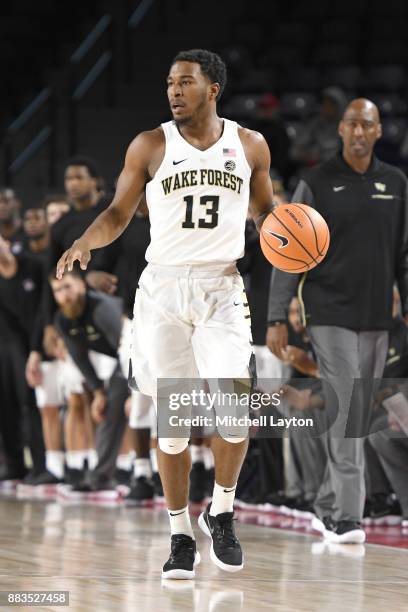 Bryant Crawford of the Wake Forest Demon Deacons dribbles the ball up court during the quarterfinals of the Paradise Jam college basketball...