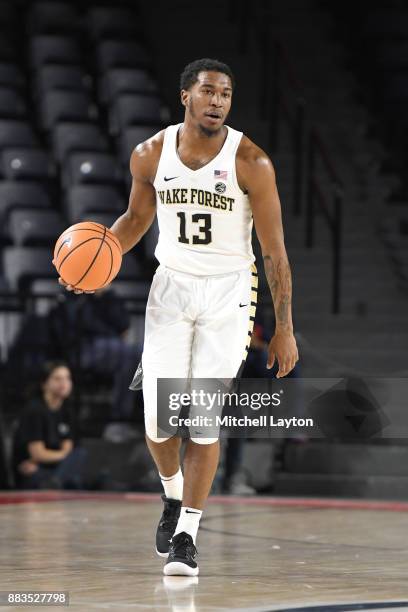 Bryant Crawford of the Wake Forest Demon Deacons dribbles up court during the quarterfinals of the Paradise Jam college basketball tournament against...