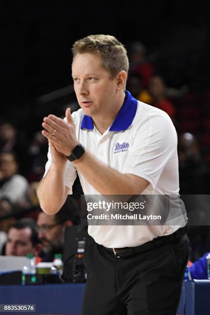 Head coach Niko Medved of the Drake Bulldogs cheers his players during the quarterfinals of the Paradise Jam college basketball tournament against...