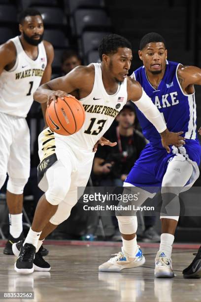 Bryant Crawford of the Wake Forest Demon Deacons dribbles the ball during the quarterfinals of the Paradise Jam college basketball tournament against...