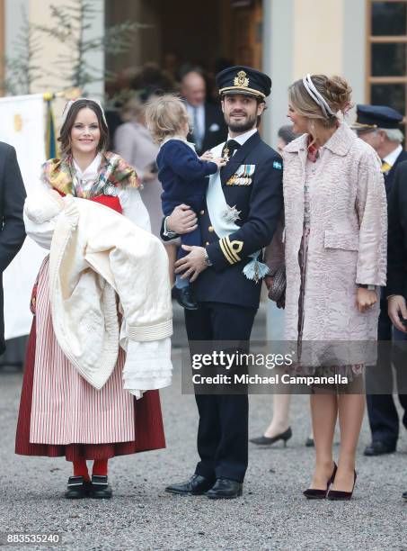 Prince Gabriel of Sweden, Duke of Dalarna held by Princess Sofia of Sweden and Prince Carl Philip holding Prince Alexander, Duke of Sodermanland and...