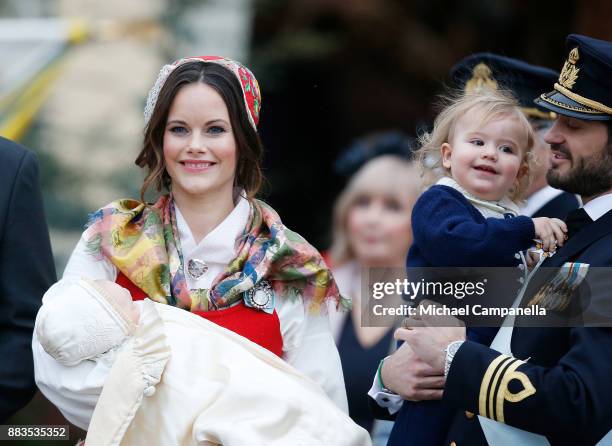 Prince Gabriel of Sweden, Duke of Dalarna held by Princess Sofia of Sweden and Prince Carl Philip holding Prince Alexander, Duke of Sodermanland...