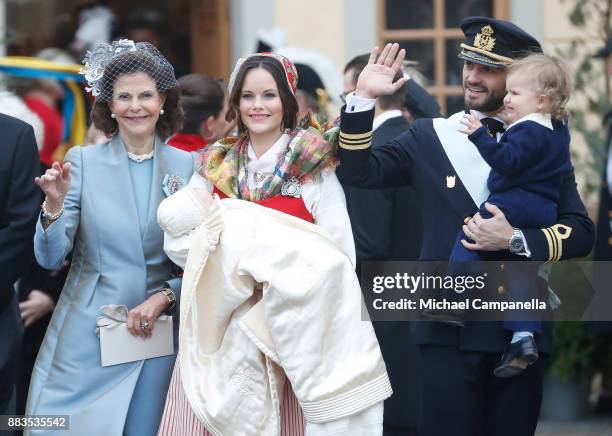 Queen Silvia of Sweden, Prince Gabriel of Sweden, Duke of Dalarna held by Princess Sofia of Sweden and Prince Carl Philip holding Prince Alexander,...