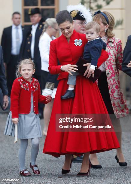 Princess Estelle, Duchess of Ostergotland, Victoria, Crown Princess of Sweden and Prince Oscar, Duke of Skane leave the chapel after the christening...