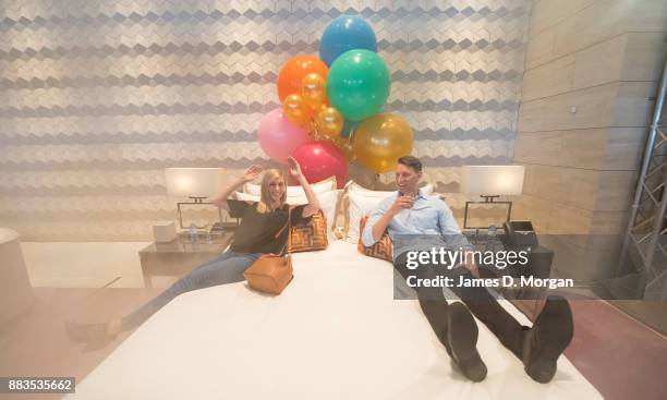 Bec Ormond and Mike Pinker inside a live art installation in the hotel lobby of Crown Towers Perth on December 1, 2017 in Perth, Australia. As part...