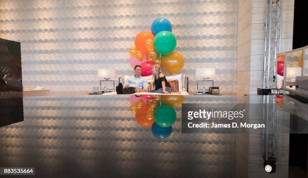 Bec Ormond and Mike Pinker inside a live art installation in the hotel lobby of Crown Towers Perth on December 1, 2017 in Perth, Australia. As part...