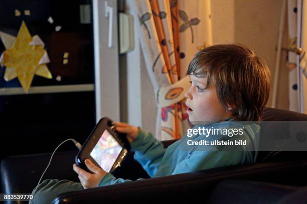 Boy playing Wii U